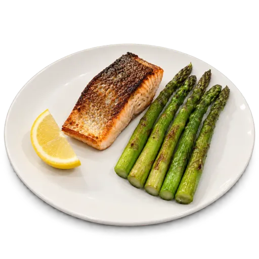 AI-made sample seared salmon fillet with five asparagus spears and a lemon wedge cut out on a transparent background, the plate's contact shadow kept as soft transparency; generated demonstration, not a real customer dish. Shown on a white surface.